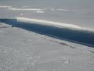 This photo, taken onboard the Chilean Navy P3 aircraft, shows the ice front of Venable Ice Shelf, West Antarctica, in October 2008. It is an example of a small-size ice shelf that is a large melt water producer.