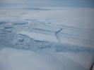 This photo, aken onboard a National Science Foundation/NASA chartered Twin Otter aircraft, shows the ice front of Dibble Ice Shelf, East Antarctica, a significant melt water producer from the Wilkes Land region, East Antarctica.