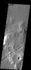 A graben is a downdropped block of material bounded on both sides by faults. The graben in this image from NASA's 2001 Mars Odyssey spacecraft follows the trend of the nearby Sirenum Fossae graben.
