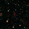 The collection of red dots seen here show one of several very distant galaxy clusters discovered by combining ground-based optical data from the NOAO's Kitt Peak National Observatory with infrared data from NASA's Spitzer Space Telescope.