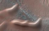 This observation from NASA's Mars Reconnaissance Orbiter is of one many that highlights new discoveries; one of these is that many sand dunes and ripples are moving, some at rates of several meters per year.