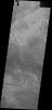 The channel in the bottom part of this image captured by NASA's 2001 Mars Odyssey spacecraft was created by lava flow rather than water flow. This feature is located in the Tharsis plains east of Olympus Mons.