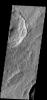 Numerous dark slope streaks are located on the inner rim of this unnamed crater in Terra Sabaea. This image is from NASA's 2001 Mars Odyssey spacecraft.