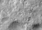 NASA's Curiosity Mars rover and tracks left by its driving appear in this portion of a Dec. 11, 2013, observation by the HiRISE camera on NASA's Mars Reconnaissance Orbiter. The rover is near the lower-left corner of this view.
