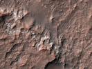This image from NASA's Mars Reconnaissance Orbiter shows chlorides that have a bright appearance and are covered by other dark materials.