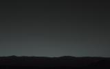 This view of the twilight sky and Martian horizon taken by NASA's Curiosity Mars rover includes Earth as the brightest point of light in the night sky. Earth is a little left of center in the image, and our moon is just below Earth.