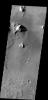Bright windstreaks are located around several small craters at the top of this image captured by NASA's 2001 Mars Odyssey spacecraft.