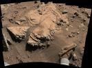 NASA's Curiosity Mars rover has driven within robotic-arm's reach of the sandstone slab at the center of this view.
