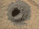 NASA's Curiosity Mars rover completed a shallow 'mini drill' test April 29, 2014, in preparation for full-depth drilling at a rock target called 'Windjana.' The hole results from the test is 0.63 inch across and about 0.8 inch deep.