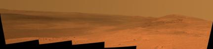 This vista of the Endeavour Crater rim was acquired by NASA's Mars Exploration Rover Opportunity's panoramic camera on April 18, 2014, from the southern end of 'Murray Ridge' on the western rim of the crater.