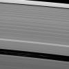 Although it appears empty from a distance, the Encke gap in Saturn's A ring has three ringlets threaded through it, two of which are visible here from NASA's Cassini spacecraft.