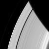 Saturn's innermost moon Pan orbits the giant planet seemingly alone in a ring gap its own gravity creates. This image was taken by NASA's Cassini spacecraft, this image.