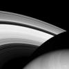 This image from NASA's Cassini spacecraft shows befitting moons named for brothers, Prometheus and Epimetheus. Both are small, icy moons that orbit near the main rings of Saturn.