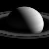 From a distance Saturn seems to exude an aura of serenity and peace in this image from NASA's Cassini spacecraft. In spite of this appearance, Saturn is an active and dynamic world. Mimas is seen to the upper-right of Saturn.