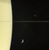 On March 13, 2006 Cassini's narrow-angle camera captured this look at Saturn and its rings, seen here nearly edge on. The frame also features Mimas and tiny Janus (above the rings), and Tethys (below the rings).
