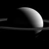 NASA's Cassini spacecraft captured Saturn, around 10 times the diameter of Earth, dwarfs it retinue of moons. Tethys is seen here at lower right.