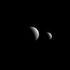 he view from NASA's Cassini spacecraft looks toward the anti-Saturn sides of Tethys and Rhea. North on both moons is up. Rhea and Tethys are medium-sized moons that are large enough to have pulled themselves into round shapes.