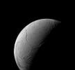 A sinuous feature snakes northward from Enceladus' south pole like a giant tentacle in this image from NASA's Cassini spacecraft. This feature, is actually tectonic in nature, created by stresses in Enceladus' icy shell.