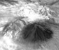 Winter still grips the volcanoes on Russia's Kamchatka peninsula. NASA's Terra spacecraft acquired this image showing the mantle of white, disturbed by dark ash entirely covering Sheveluch volcano from recent eruptions.
