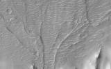On Mars, alluvial fans are sometimes visible in impact crater basins, as material from the steep rims is transported radially inward to the relatively flat floor. This image is from NASA's Mars Reconnaissance Orbiter.