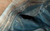 The North Polar layered deposits (NPLD) are a stack of layers of ice and dust at the North Pole of Mars. The layers are thought to have been deposited over millions of years. This image is from NASA's Mars Reconnaissance Orbiter.