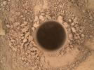 This image from the Mars Hand Lens Imager (MAHLI) camera on NASA's Curiosity Mars rover shows the first sample-collection hole drilled in Mount Sharp, the layered mountain that is the science destination of the rover's extended mission.