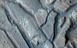 This image from NASA's Mars Reconnaissance Orbiter shows some interesting fractured materials on the floor of an impact crater in Arabia Terra.