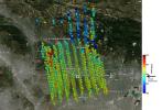 This image shows NASA's OCO-2 measurements of carbon dioxide levels over Pasadena and the northern Los Angeles, CA basin on Sept. 5, 2014. Each colored dot represents a single measurement of the greenhouse gas made during an overflight of the area.