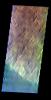 The THEMIS VIS camera contains 5 filters. The data from different filters can be combined in multiple ways to create a false color image. This false color image from NASA's 2001 Mars Odyssey spacecraft shows part of the flank of Hecates Tholus.