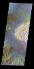 The THEMIS VIS camera contains 5 filters. The data from different filters can be combined in multiple ways to create a false color image. This false color image from NASA's 2001 Mars Odyssey spacecraft shows part of the floor of Pollack Crater.