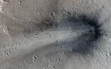 This image from NASA's Mars Reconnaissance Orbiter shows a new impact crater in Elysium Planitia.