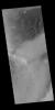 This image captured by NASA's 2001 Mars Odyssey spacecraft is of an unnamed crater in Noachis Terra. Part of the crater floor contains a dune field. Dust devil tracks are visible east of the dunes.