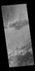 This image captured by NASA's 2001 Mars Odyssey spacecraft shows multiple dune fields cover the floor of Hooke Crater, located on the northern margin of Argyre Planitia.