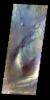 The THEMIS VIS camera contains 5 filters. The data from different filters can be combined in multiple ways to create a false color image. This false color image from NASA's 2001 Mars Odyssey spacecraft shows part of Ganges Chasma.