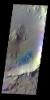 The THEMIS VIS camera contains 5 filters. The data from different filters can be combined in multiple ways to create a false color image. This false color image from NASA's 2001 Mars Odyssey spacecraft shows an unnamed crater in Elysium Planitia.