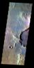 The THEMIS VIS camera contains 5 filters. The data from different filters can be combined in multiple ways to create a false color image. This false color image from NASA's 2001 Mars Odyssey spacecraft shows part of the floor of Muller Crater.