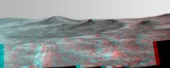 An elongated crater called 'Spirit of St. Louis,' with a rock spire in it, dominates this stereo view from the panoramic camera (Pancam) on NASA's Mars Exploration Rover Opportunity.