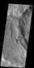 The subtle paired fractues at the bottom of this image from NASA's 2001 Mars Odyssey spacecraft are part of Sirenum Fossae. Numerous gullies at the top of the image are located on the intersection of two crater rims.