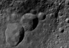 This image of Marcia AV-L-12, from the atlas of the giant asteroid Vesta, was created from images taken as NASA's Dawn mission flew around the object, also known as a protoplanet.