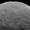 This image, taken on June 6, 2015 by NASA's Dawn spacecraft, shows Ceres from an altitude of 2,700 miles (4,400 kilometers). A mountain can be seen on the left. The western edge of Haulani crater can be seen on the upper right at the limb.