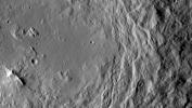NASA's Dawn spacecraft took this image that shows a mountain ridge, near lower left, that lies in the center of Urvara crater on Ceres. Urvara is an Indian and Iranian deity of plants and fields. The crater's diameter is 101 miles (163 kilometers).