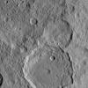 NASA's Dawn Spacecraft took this image of Gaue crater, the large crater on the bottom, on Ceres. Gaue is a Germanic goddess to whom offerings are made in harvesting rye. The resolution of the image is 450 feet (140 meters) per pixel.