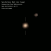 This near-true color, 'Pluto-centric' frame from a movie from NASA's New Horizons mission show Pluto and its largest moon, Charon, and the complex orbital dance of the two bodies, known as a double planet.