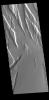 The graben and collapse features in this image captured by NASA's 2001 Mars Odyssey spacecraft are part of Ceraunius Fossae, which is located south of Alba Mons.