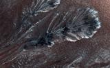 Seasonal frost commonly forms at middle and high latitudes on Mars, much like winter snow on Earth. However, on Mars most frost is carbon dioxide (dry ice) rather than water ice. This image is from NASA's Mars Reconnaissance Orbiter.