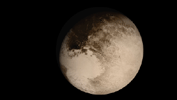This frame from an animation is a dramatic view of the Pluto system is as NASA's New Horizons spacecraft saw it in July 2015.
