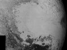 Mosaic of high-resolution images of Pluto, transmitted by NASA's New Horizons spacecraft from Sept. 5 to 7, 2015. The image is dominated by the informally-named icy plain Sputnik Planum, the smooth, bright region across the center.