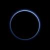 Pluto's haze layer shows its blue color in this picture taken by NASA's New Horizons. The high-altitude haze is thought to be similar in nature to that seen at Saturn's moon Titan.