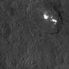 One of the most intriguing features on Ceres, Occator crater, is seen in this oblique view from NASA's Dawn spacecraft and is home to the brightest areas on Ceres. Dawn took this image on Oct. 18, 2015.
