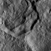 This image from NASA's Dawn spacecraft, taken Dec. 19, 2015, shows part of Messor Crater, at northern mid-latitudes on Ceres. The scene shows an older crater in which a large lobe-shaped flow partly covers the northern (top) part of the crater floor.